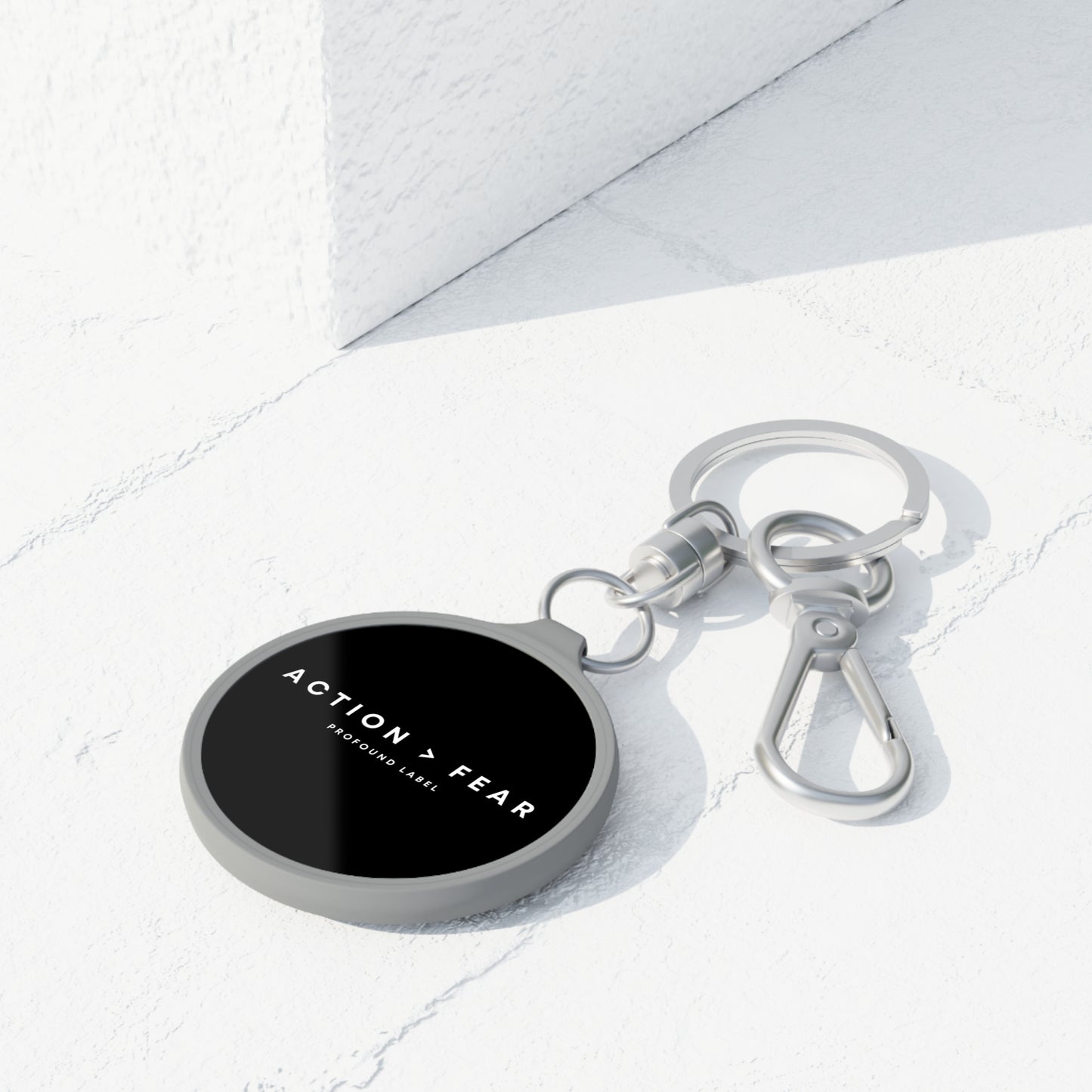 ACTION IS GREATER THAN FEAR KEYRING