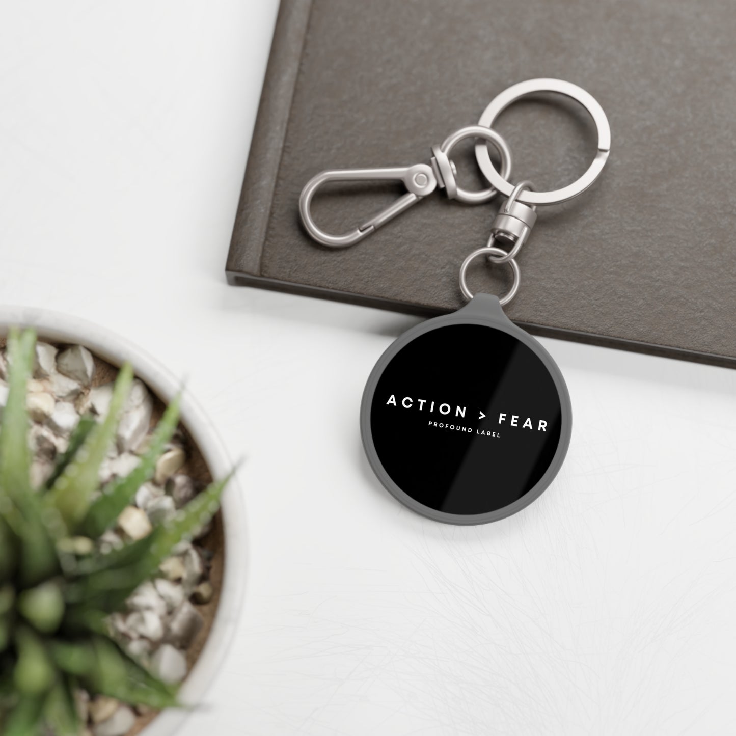 ACTION IS GREATER THAN FEAR KEYRING